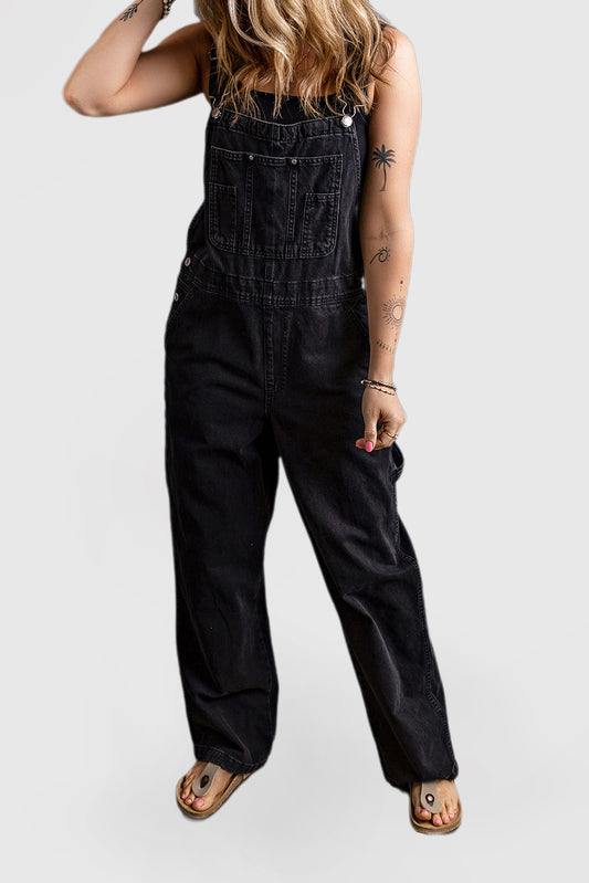 Black denim jumpsuit with adjustable buckle straps and multiple pockets