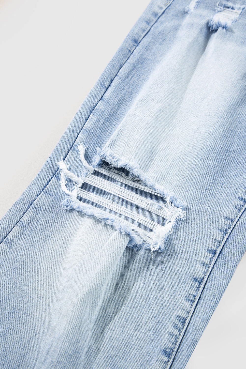 Beau Blue Light-Wash Flare Jeans with Distressed Detailing