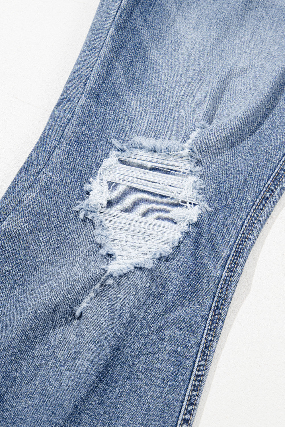 Dusk Blue High-Rise Flared Jeans with Distressed Hem